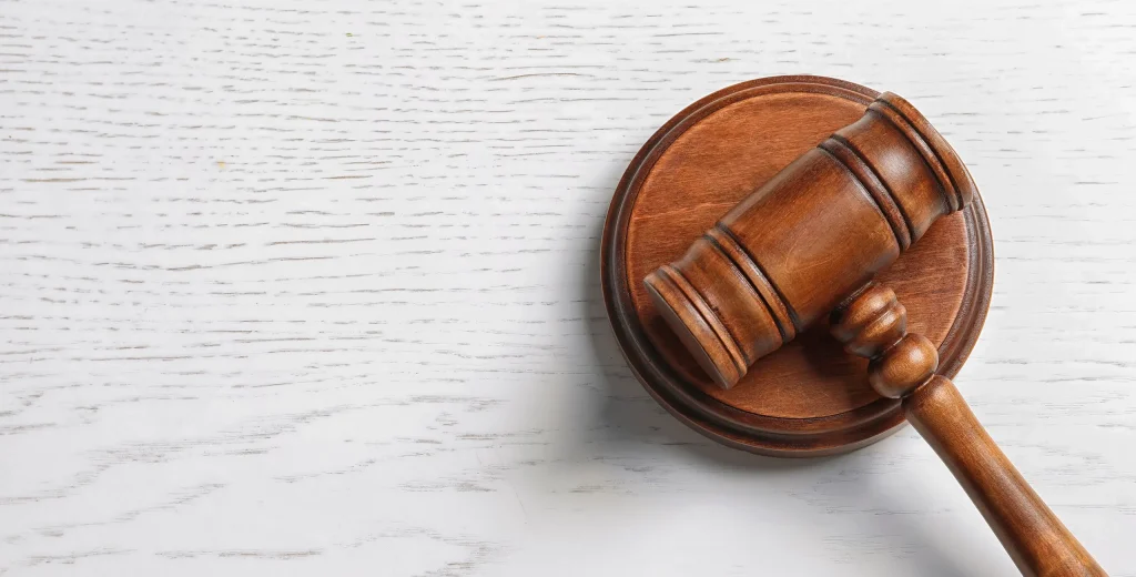 Gavel on a desk representing the Multistate Pharmacy Jurisprudence Examination known as the MPJE exam.