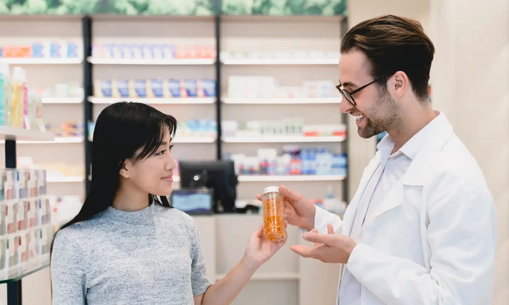 Pharmacist with a patient